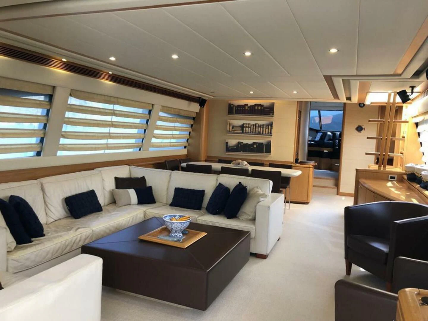 a living room with a couch and a coffee table aboard MAR AZUL Yacht for Sale