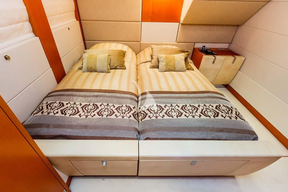 a bed with a couple of beds aboard AGRAM Yacht for Charter