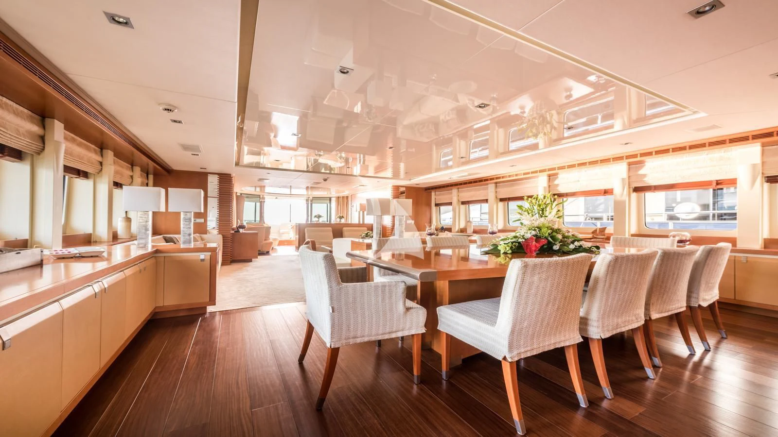 a large room with tables and chairs aboard AGRAM Yacht for Charter