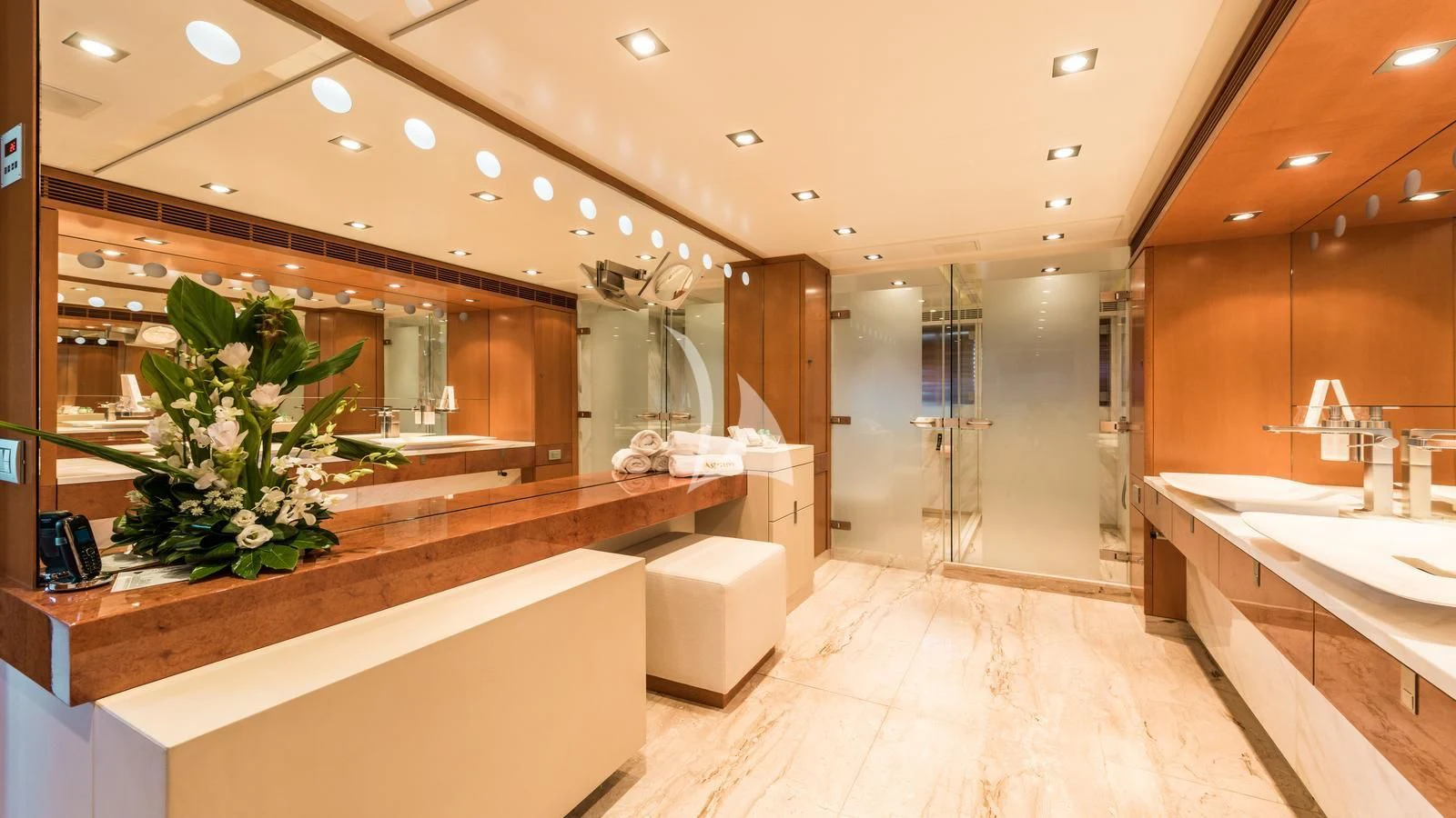 a large bathroom with a large mirror aboard AGRAM Yacht for Charter