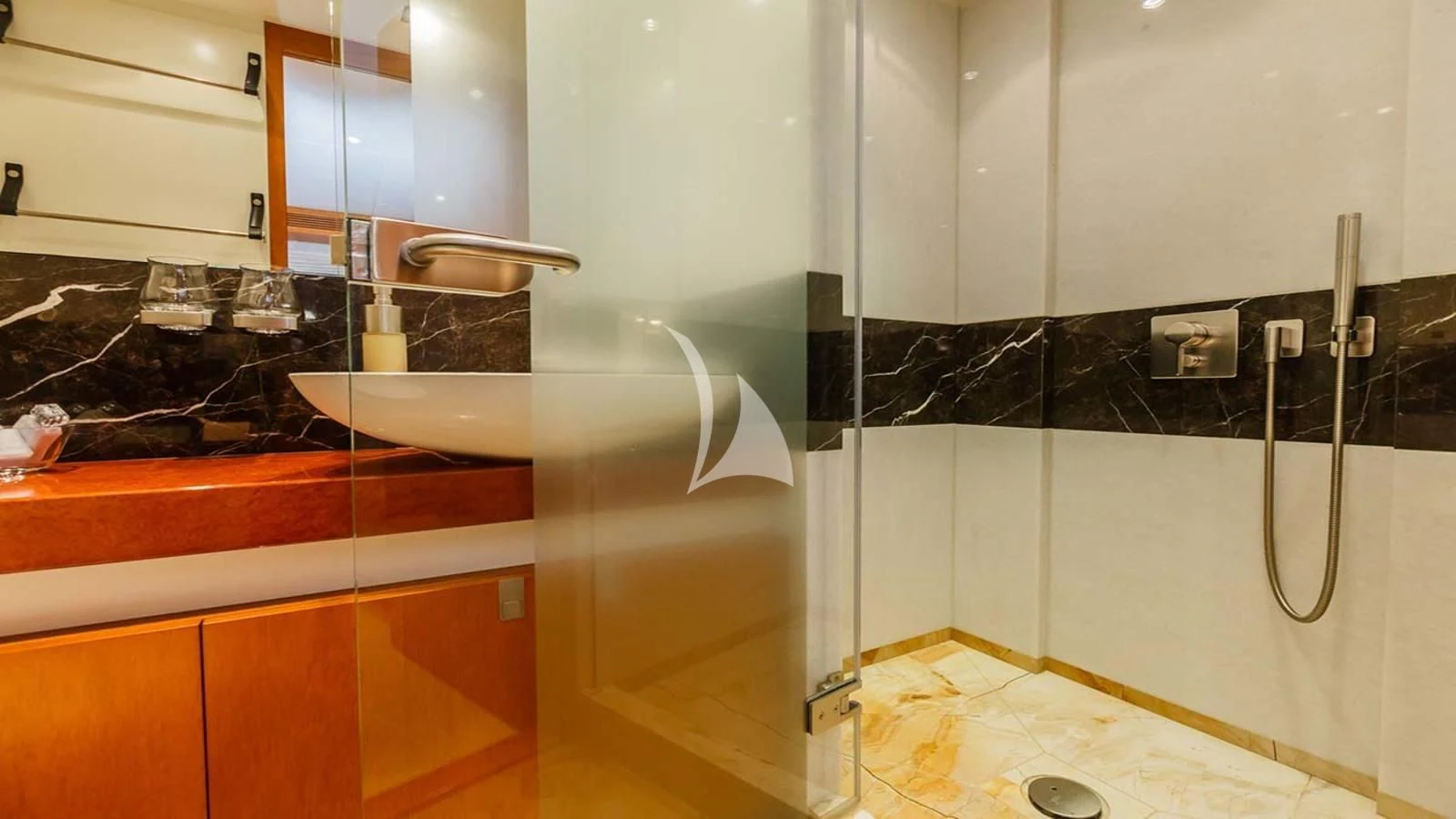a bathroom with a shower unit aboard AGRAM Yacht for Charter