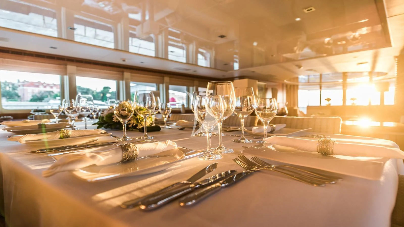 a table with wine glasses and napkins on it aboard AGRAM Yacht for Charter