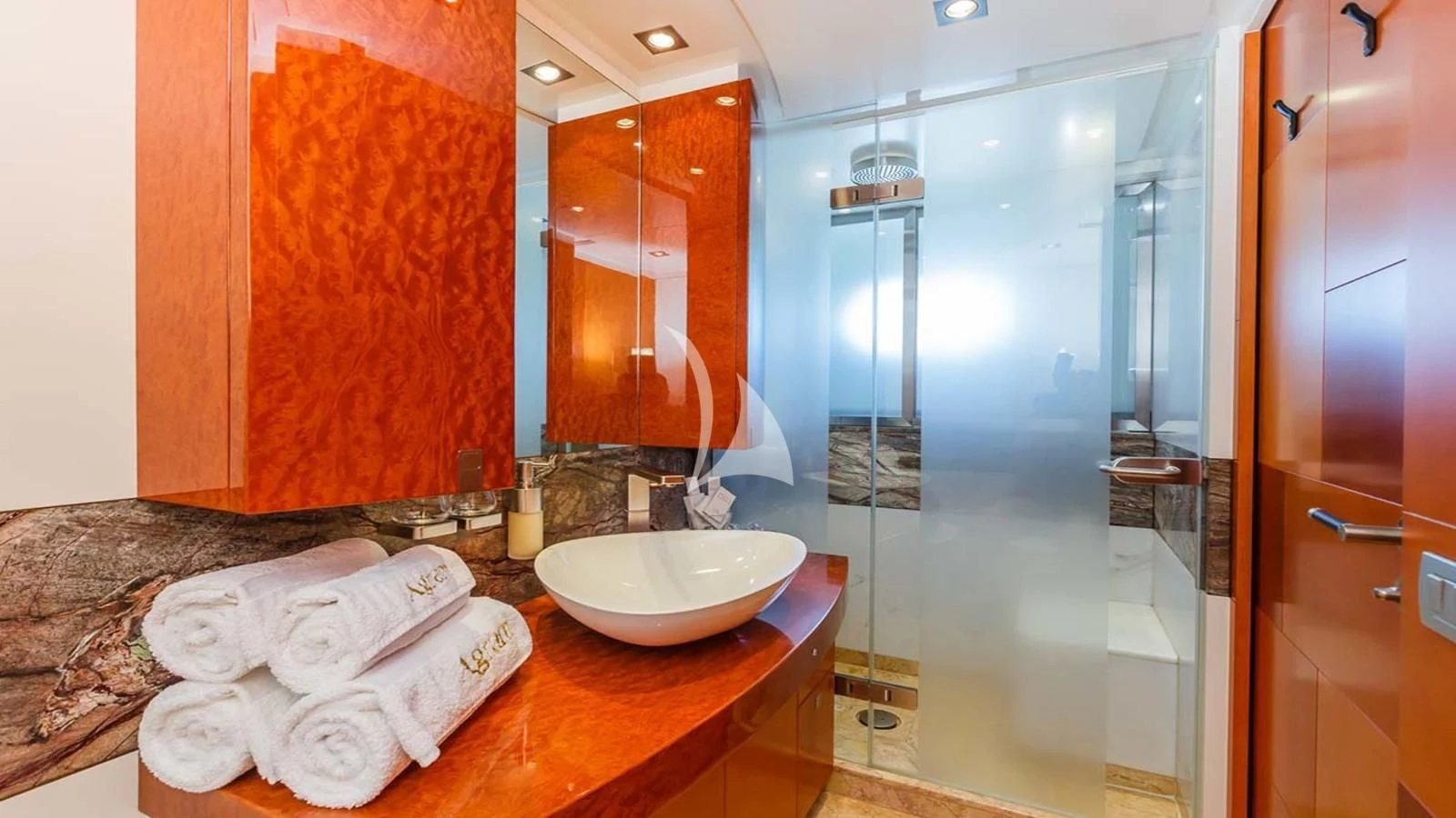 a bathroom with a sink and a shower aboard AGRAM Yacht for Charter