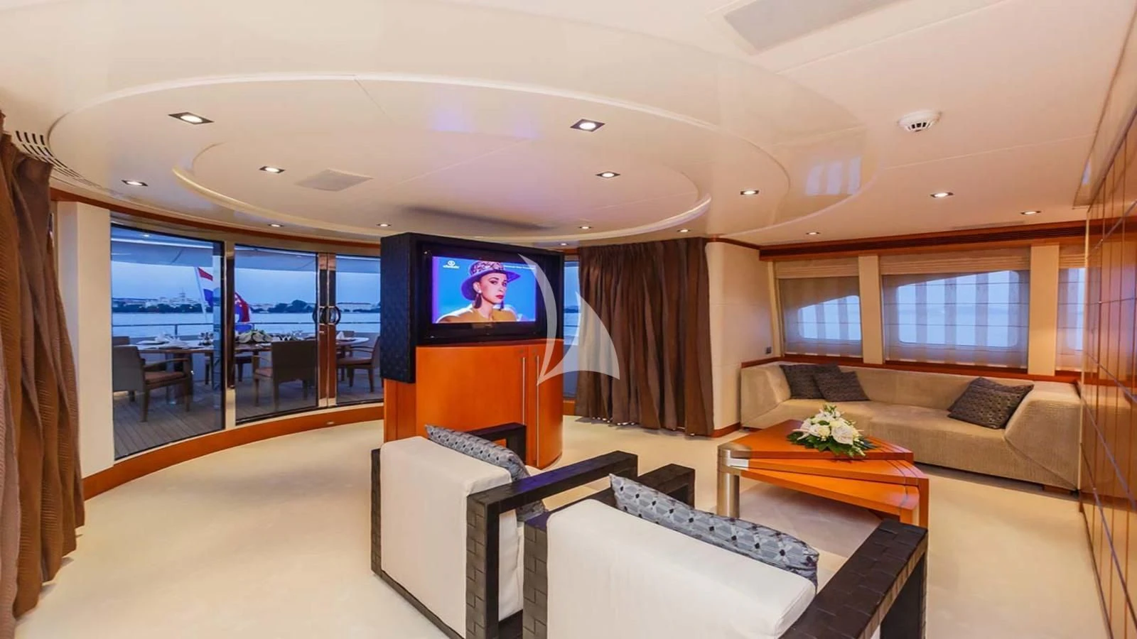 a living room with a large screen aboard AGRAM Yacht for Charter