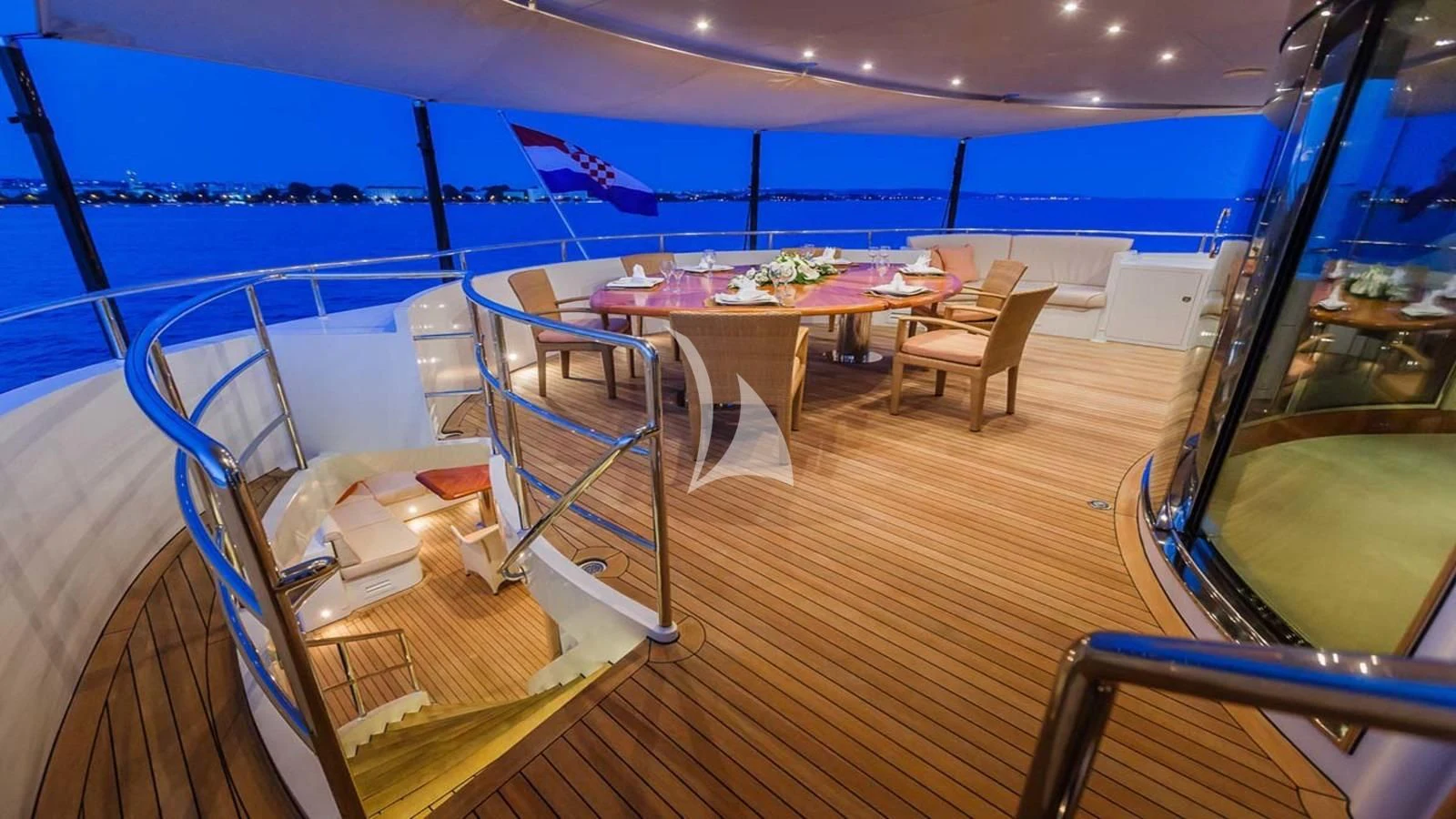 a room with a table and chairs aboard AGRAM Yacht for Charter