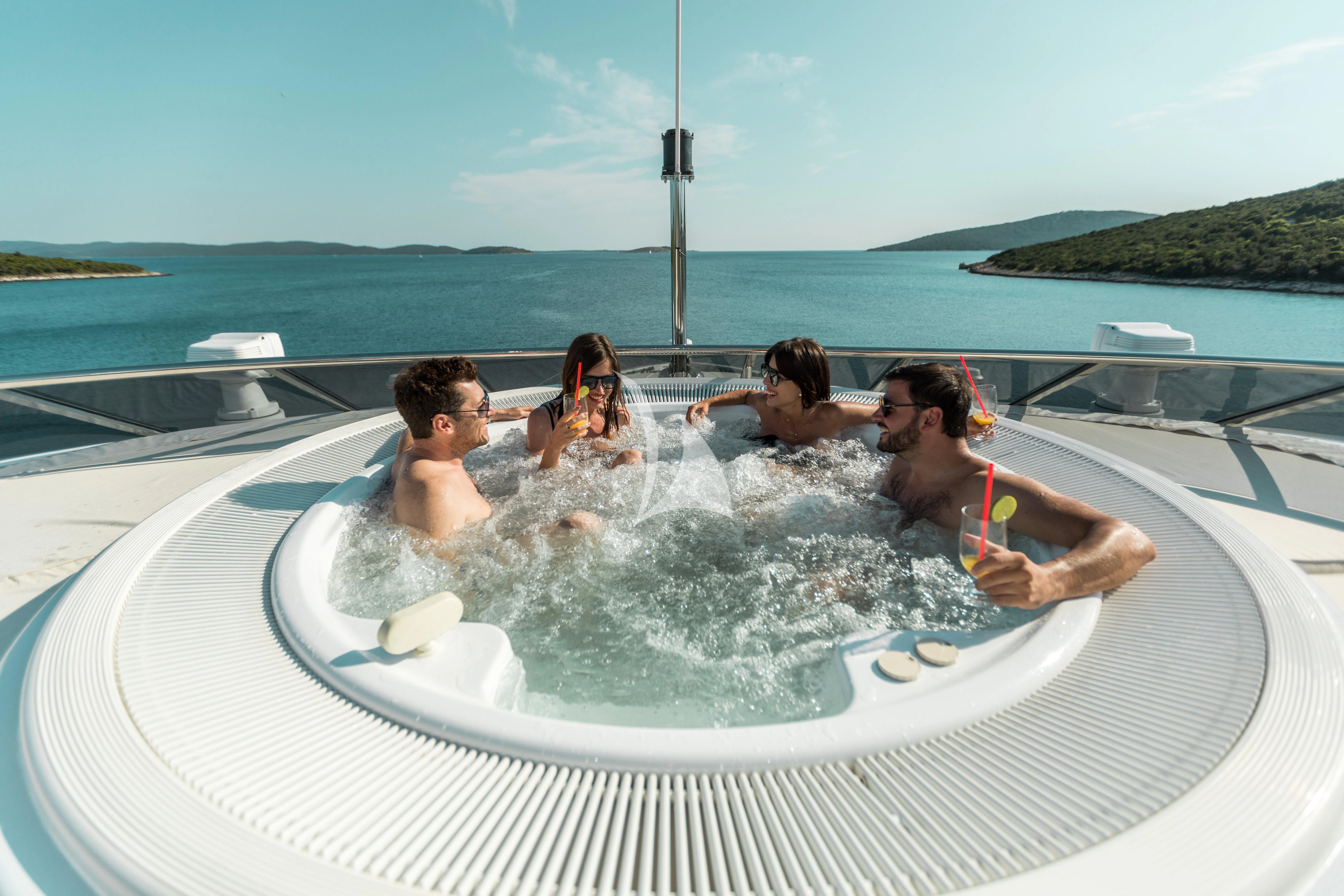 a group of people in a pool aboard AGRAM Yacht for Charter