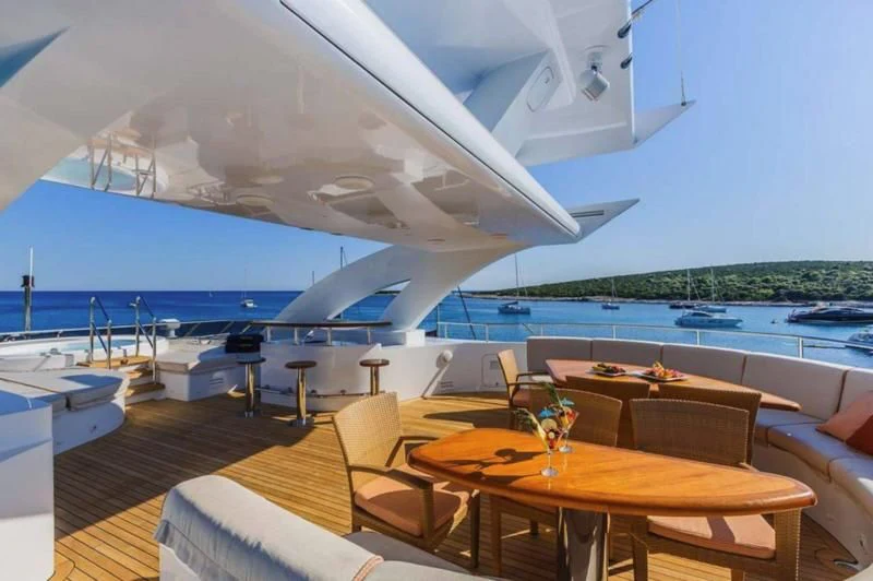 a room with a table and chairs aboard AGRAM Yacht for Charter