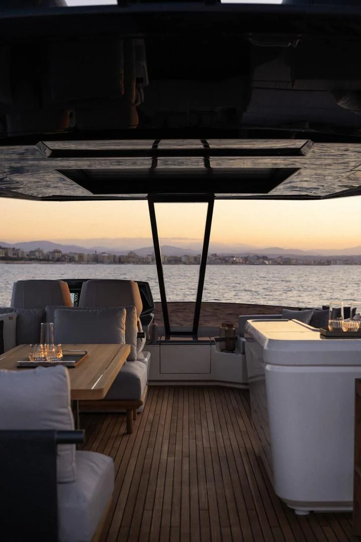 a deck with a table and chairs aboard ALVEARE Yacht for Sale