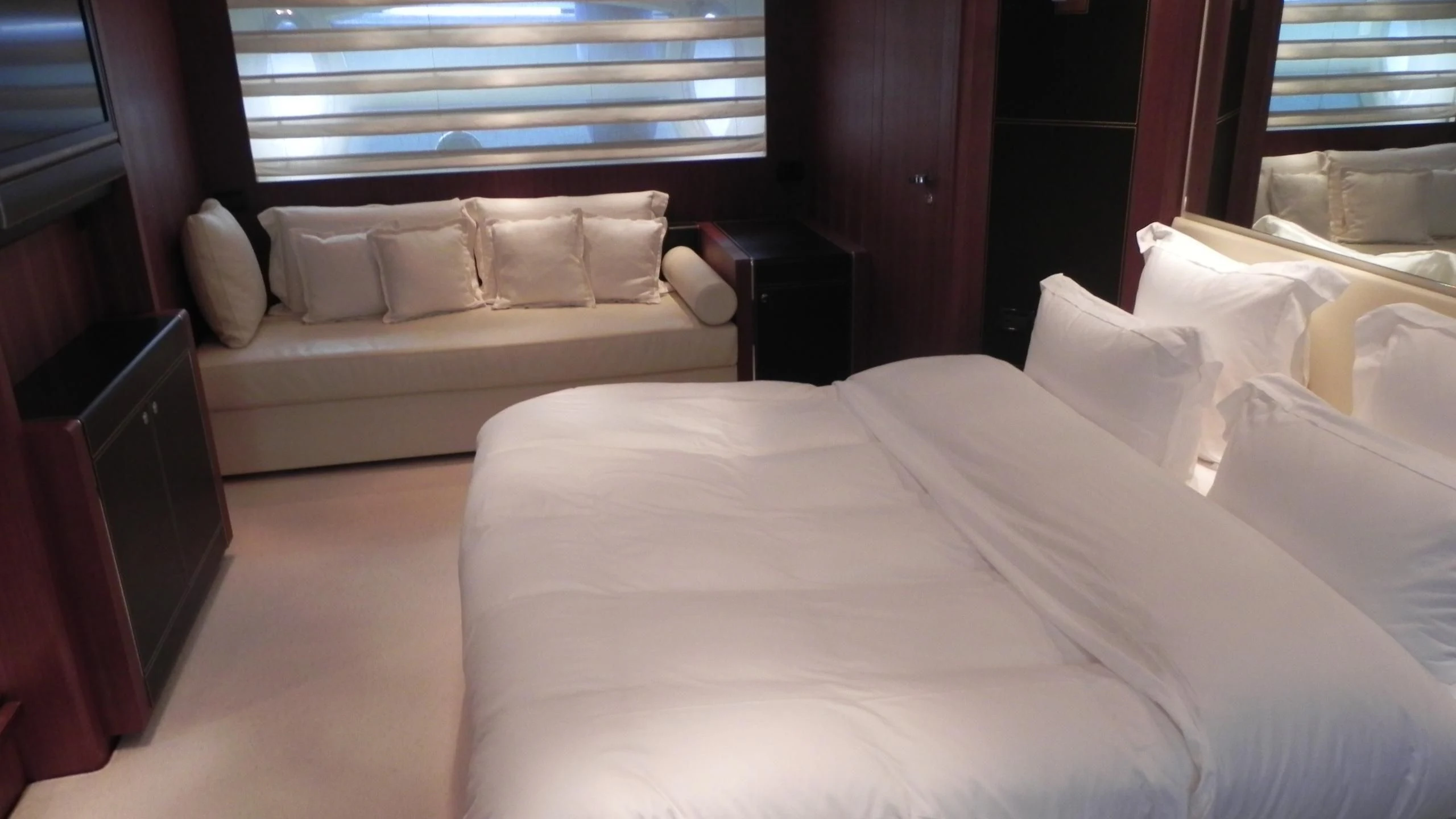 a bed with white sheets aboard WEDGE THREE Yacht for Sale