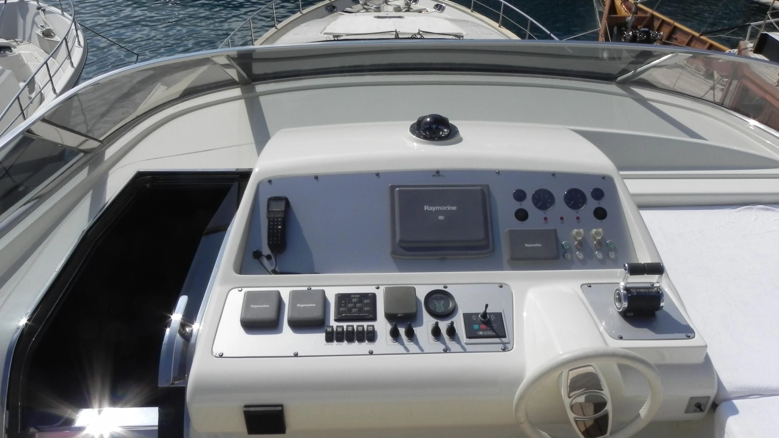 the inside of a white car aboard WEDGE THREE Yacht for Sale