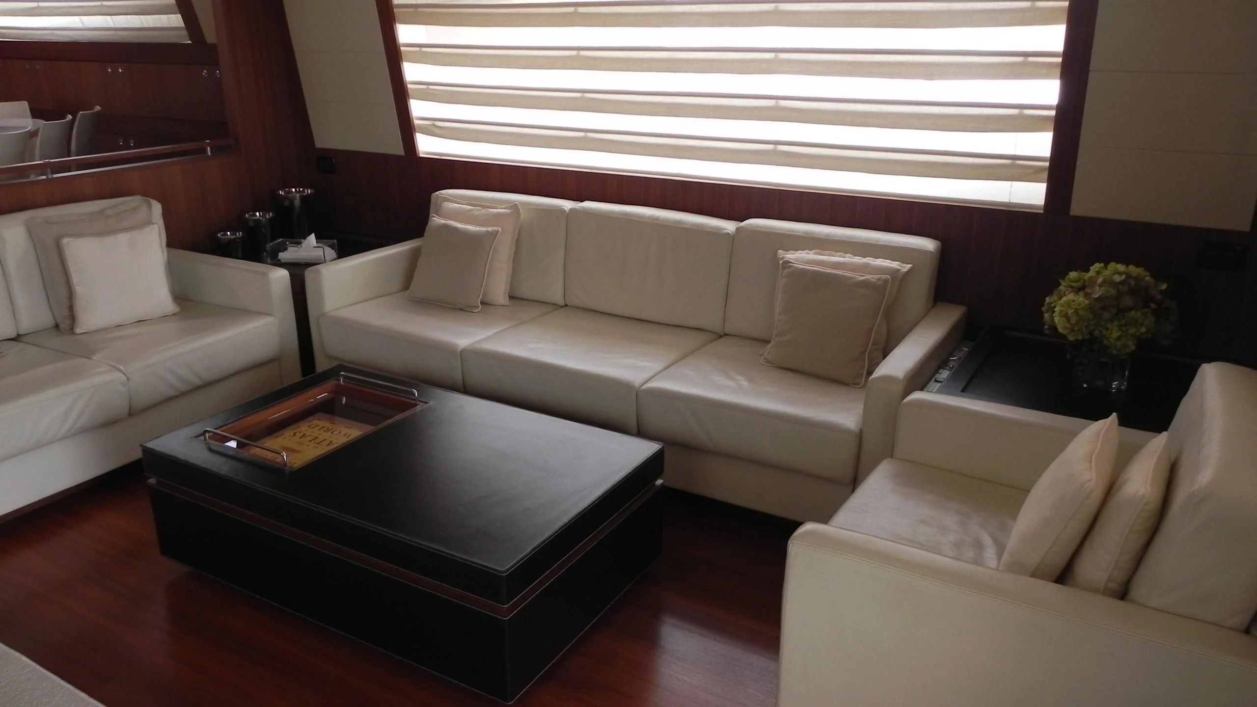 a living room with a coffee table aboard WEDGE THREE Yacht for Sale