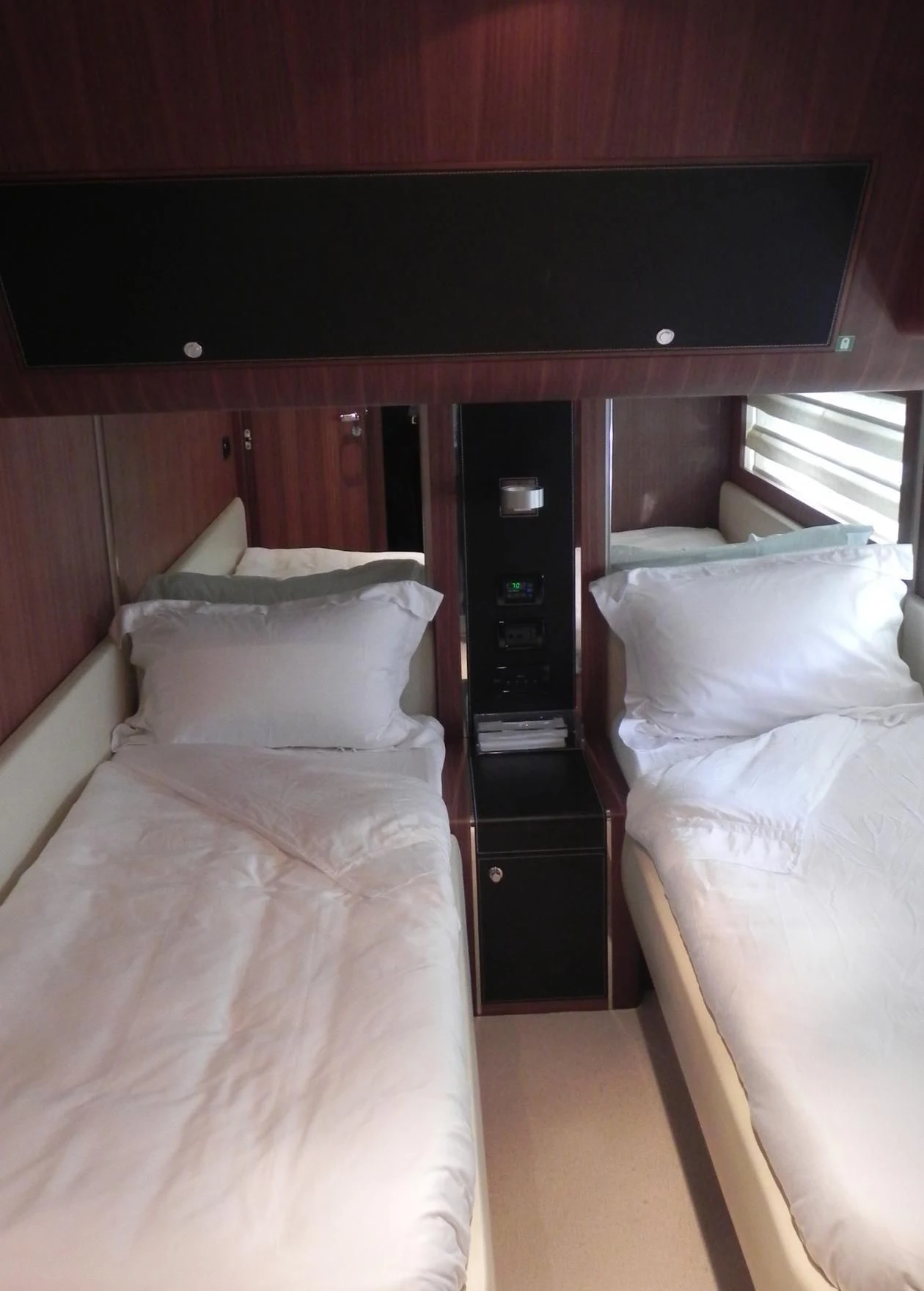 a room with a bed and a desk aboard WEDGE THREE Yacht for Sale