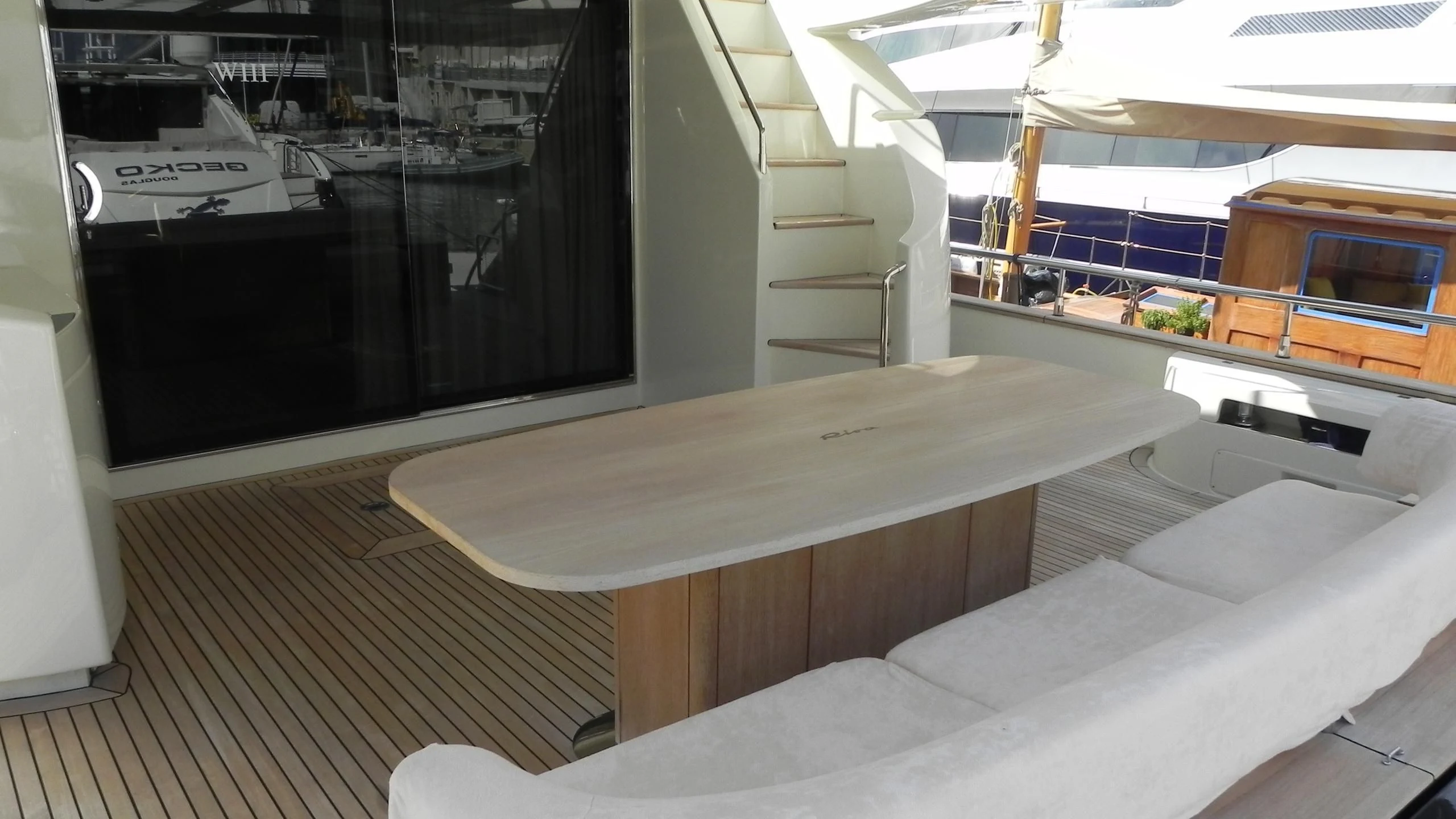 a room with a table and chairs aboard WEDGE THREE Yacht for Sale