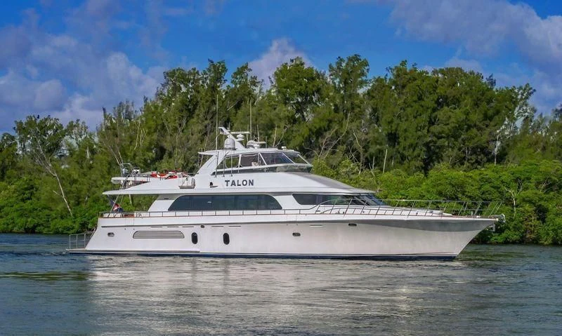 a white boat on the water aboard WINDWARD Yacht for Charter
