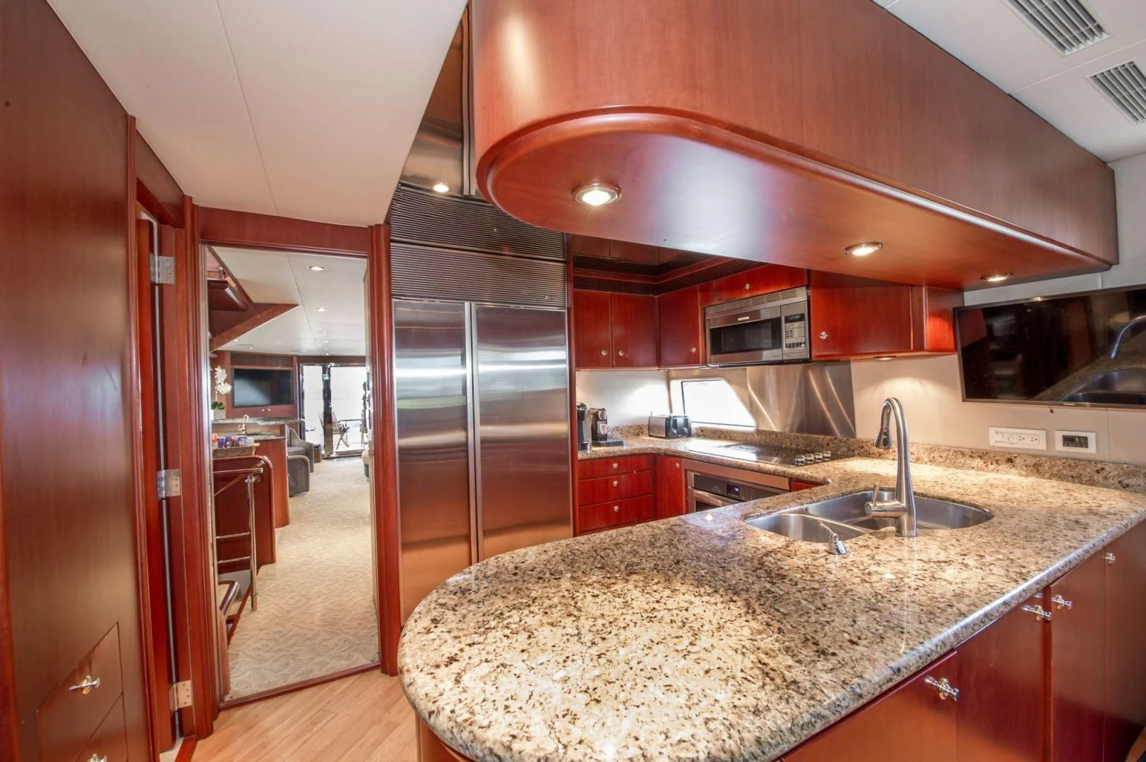 a kitchen with a large island aboard WINDWARD Yacht for Charter