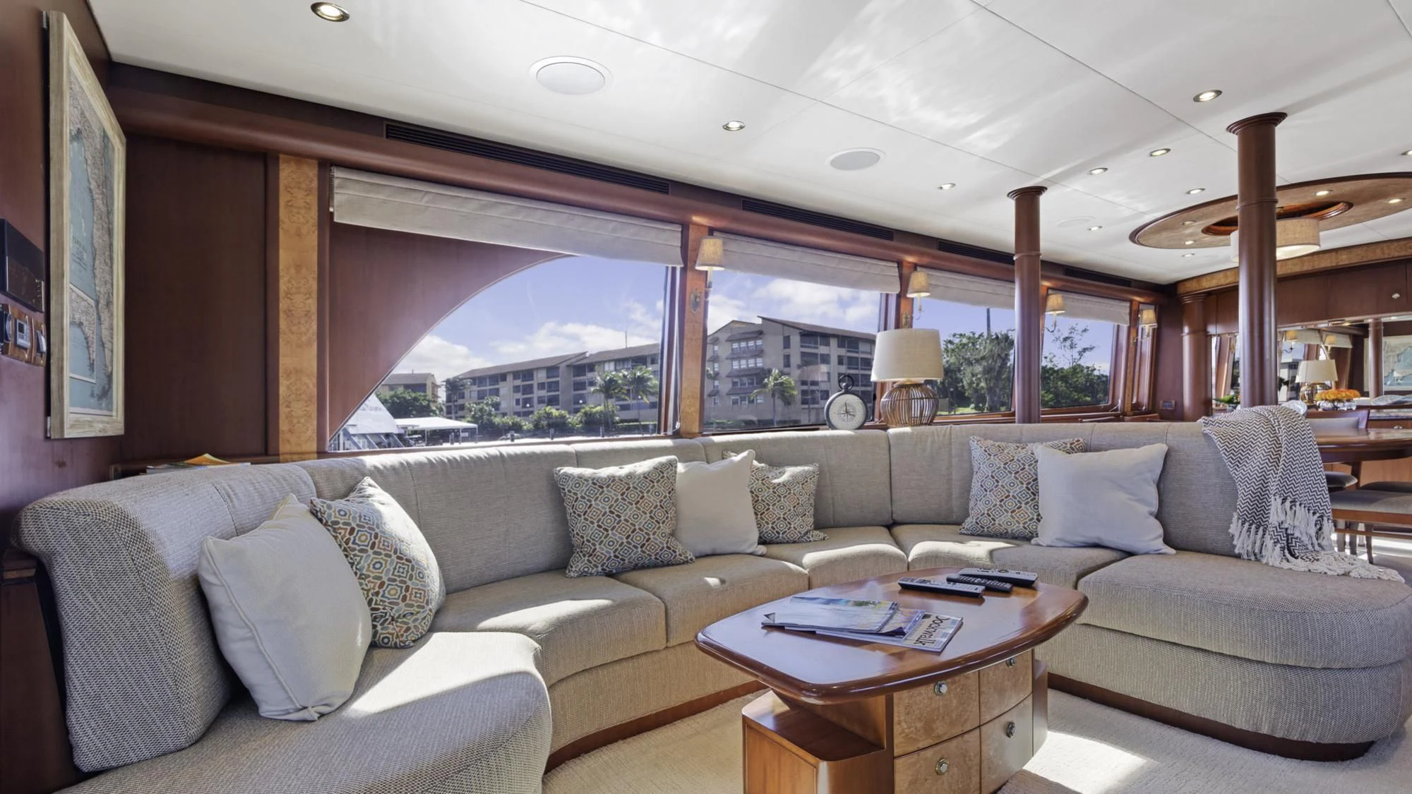 a living room with a large window aboard WINDWARD Yacht for Charter