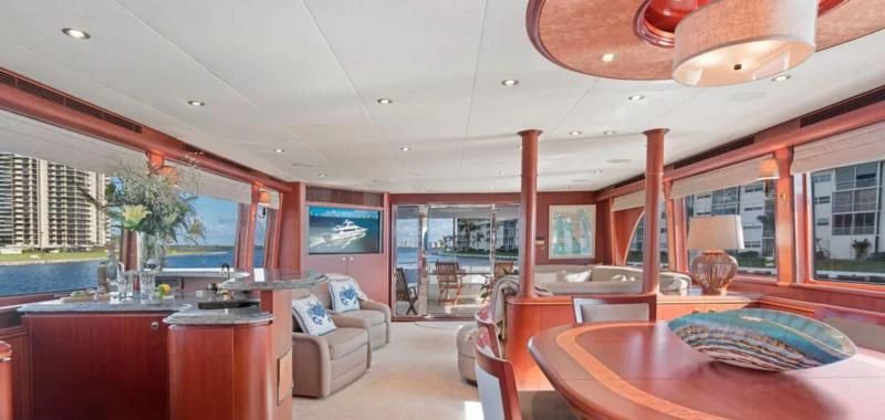 a living room with a table and chairs aboard WINDWARD Yacht for Charter