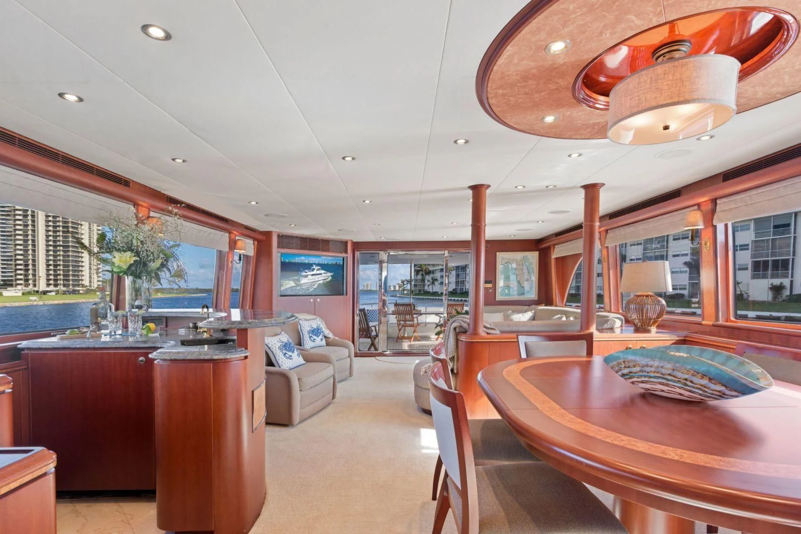 a room with a table and chairs aboard WINDWARD Yacht for Charter