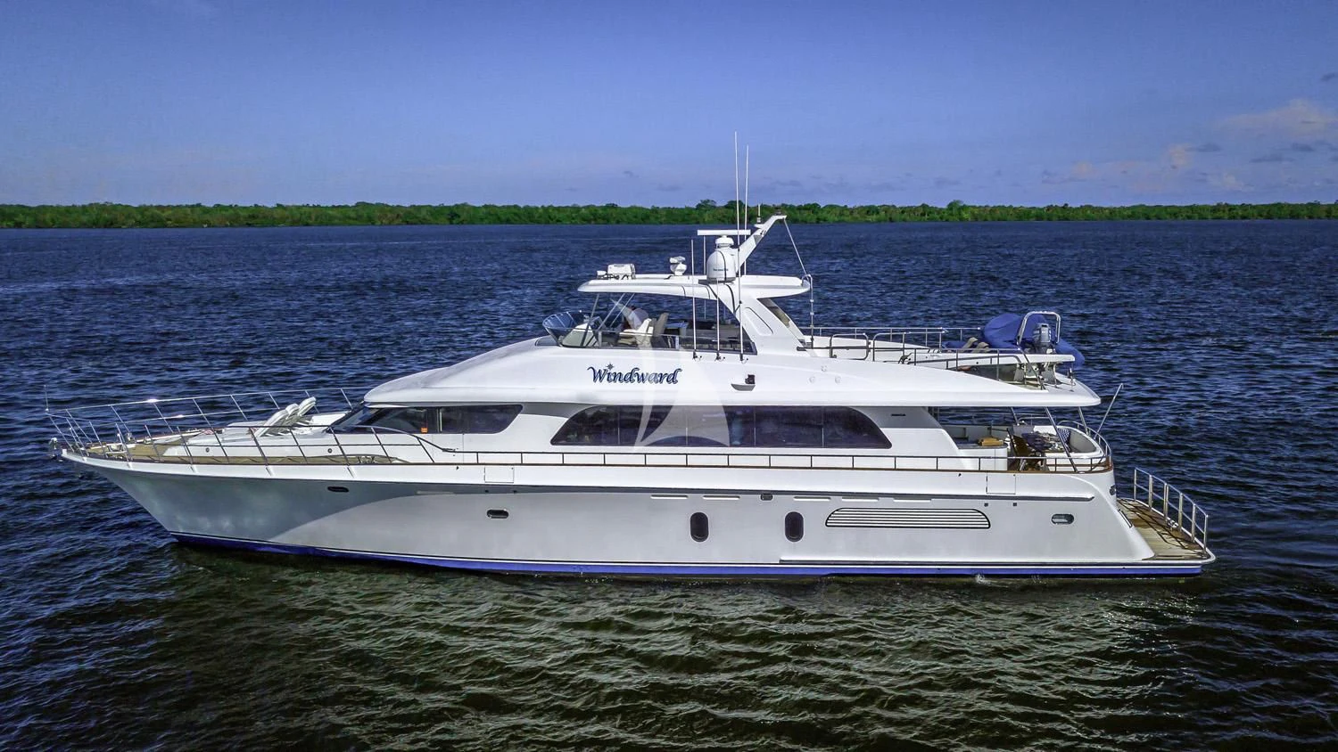 a white yacht in the water aboard WINDWARD Yacht for Charter