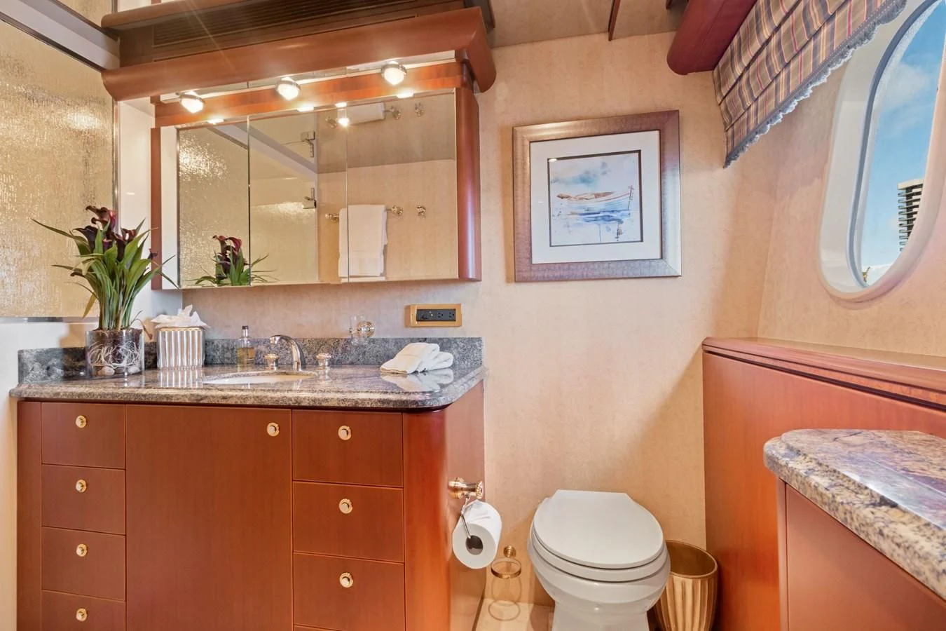 a bathroom with a sink and a mirror aboard WINDWARD Yacht for Charter