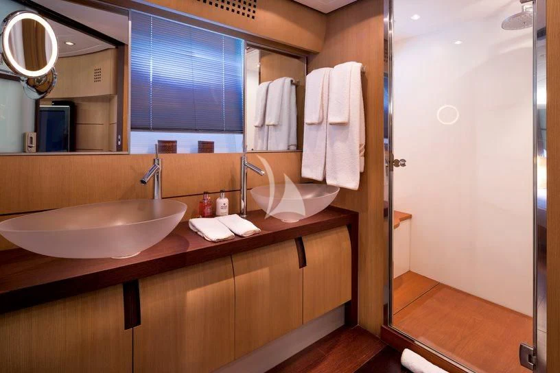 a bathroom with a sink and a mirror aboard WINDWARD Yacht for Charter