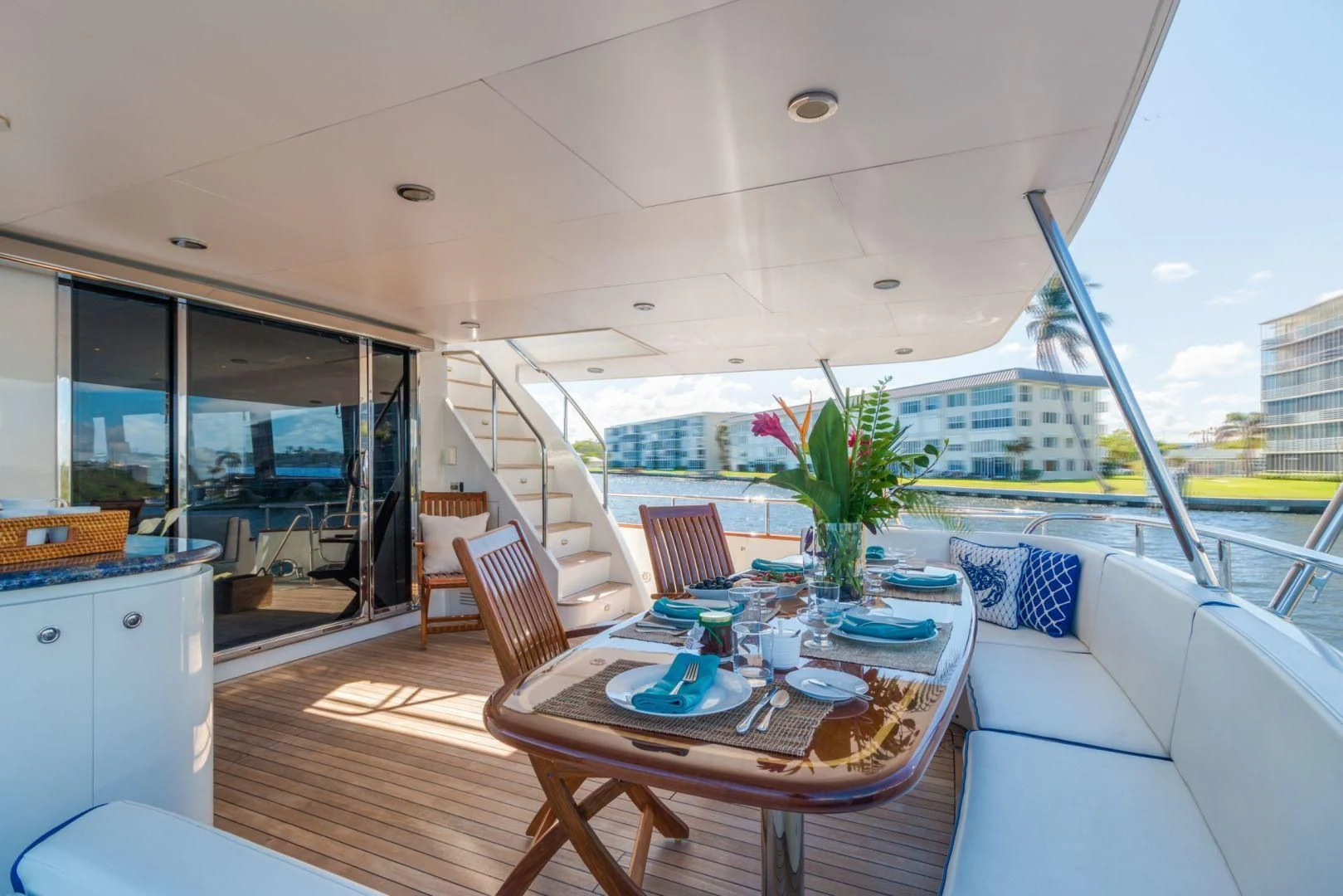 a table and chairs on a deck aboard WINDWARD Yacht for Charter