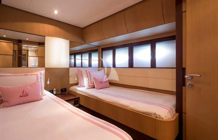 a couple of beds in a room aboard WINDWARD Yacht for Charter