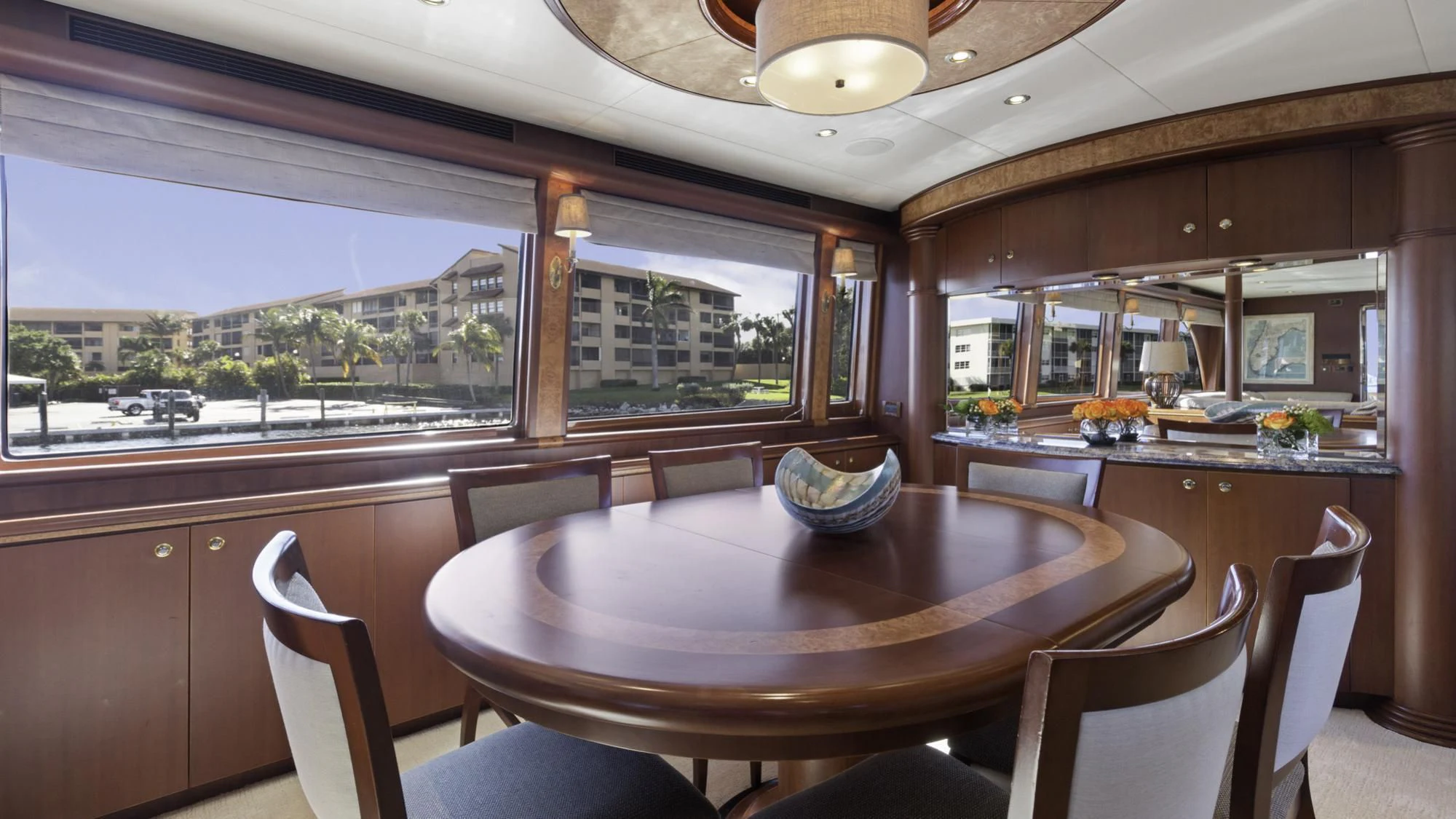 a kitchen with a table and chairs aboard WINDWARD Yacht for Charter