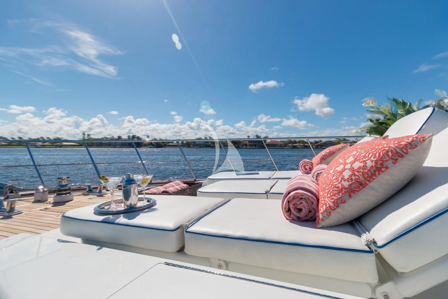 a boat with red pillows on the water aboard WINDWARD Yacht for Charter