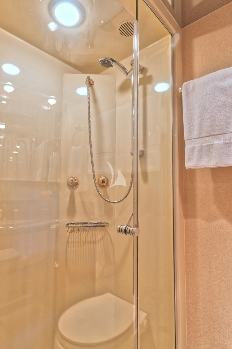 a bathroom with a glass shower aboard WINDWARD Yacht for Charter
