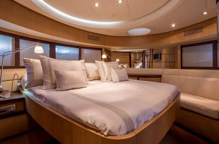 a large bed in a room aboard WINDWARD Yacht for Charter