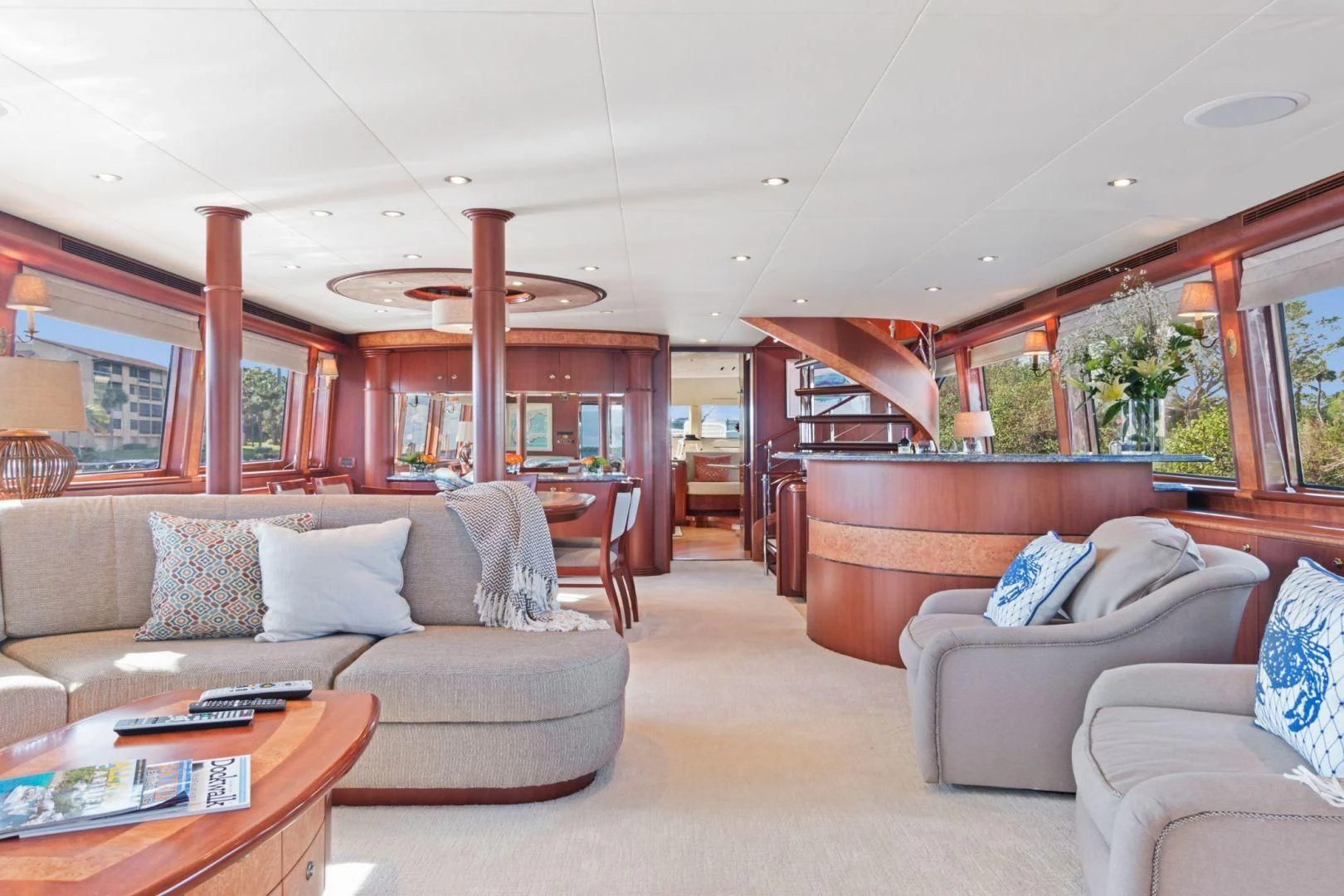 a living room with a couch and a table aboard WINDWARD Yacht for Charter