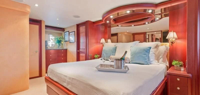 a bed with a tray on it aboard WINDWARD Yacht for Charter