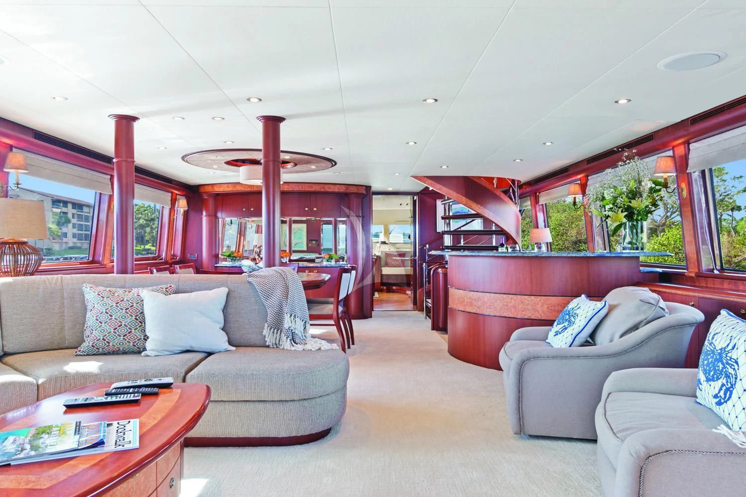 a living room with a couch and a table aboard WINDWARD Yacht for Charter