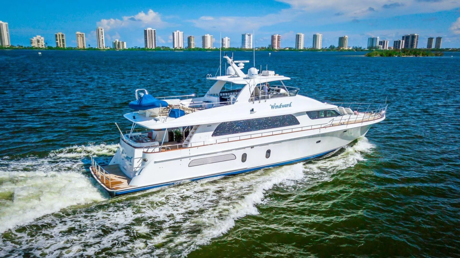 a white yacht on the water aboard WINDWARD Yacht for Charter