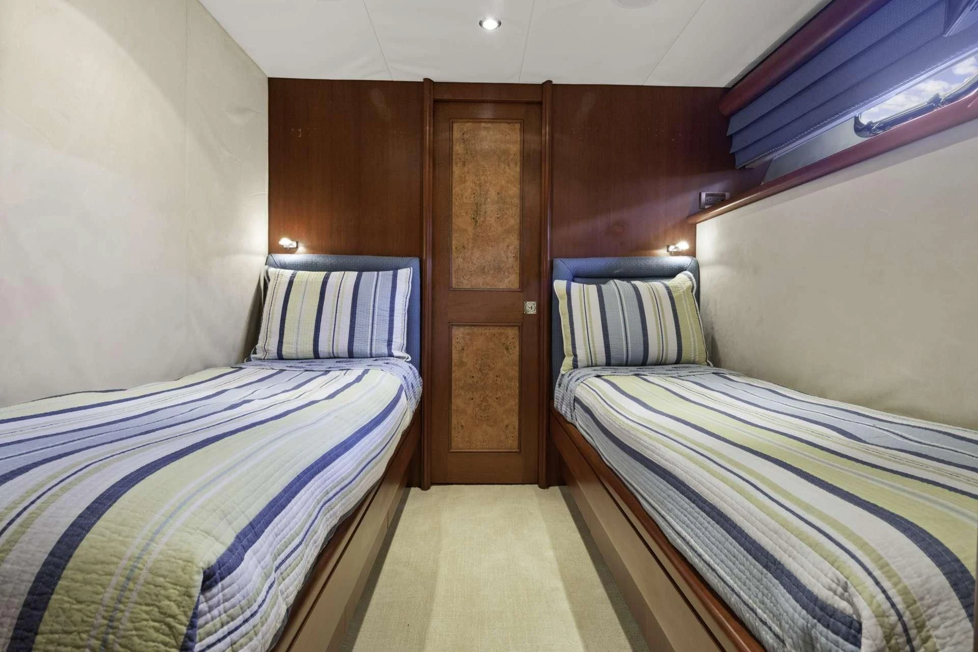 a couple of beds in a room aboard WINDWARD Yacht for Charter