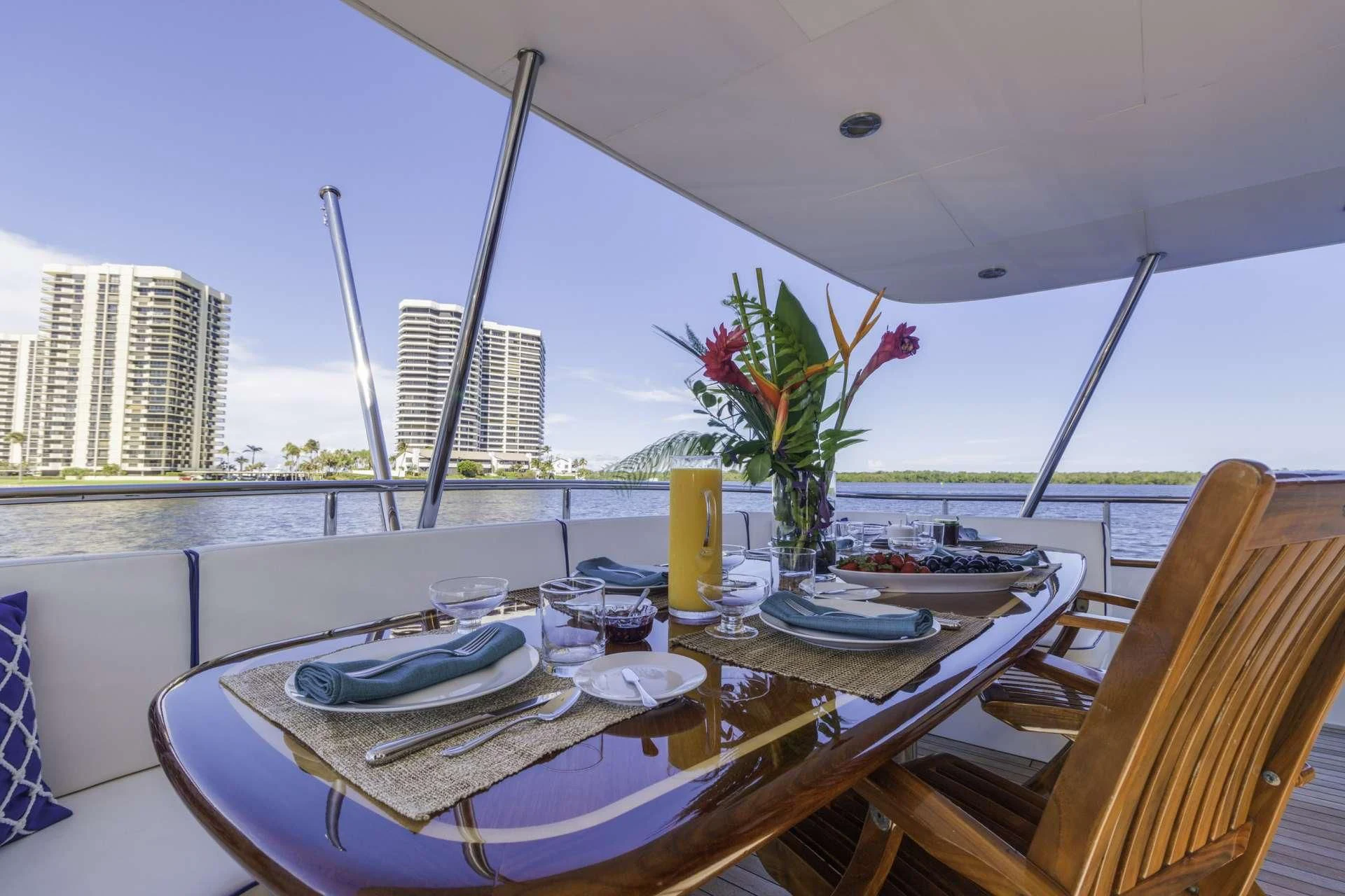 a table with plates and glasses on it aboard WINDWARD Yacht for Charter