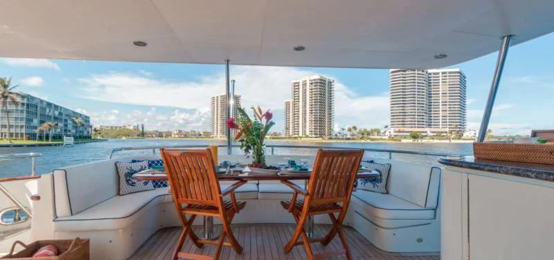 a table and chairs on a deck aboard WINDWARD Yacht for Charter