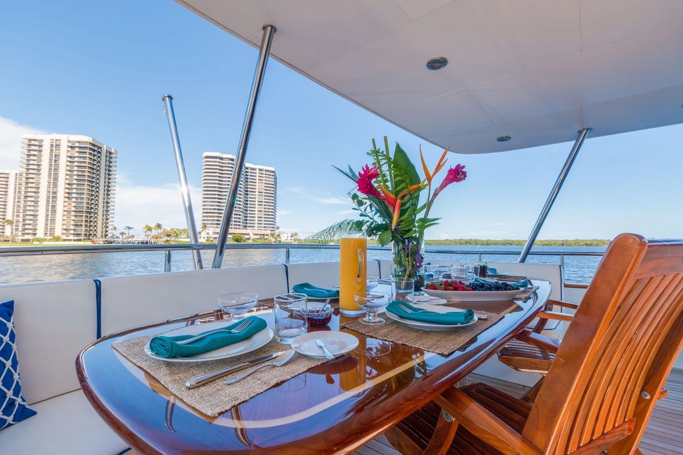 a table with plates and glasses on it aboard WINDWARD Yacht for Charter