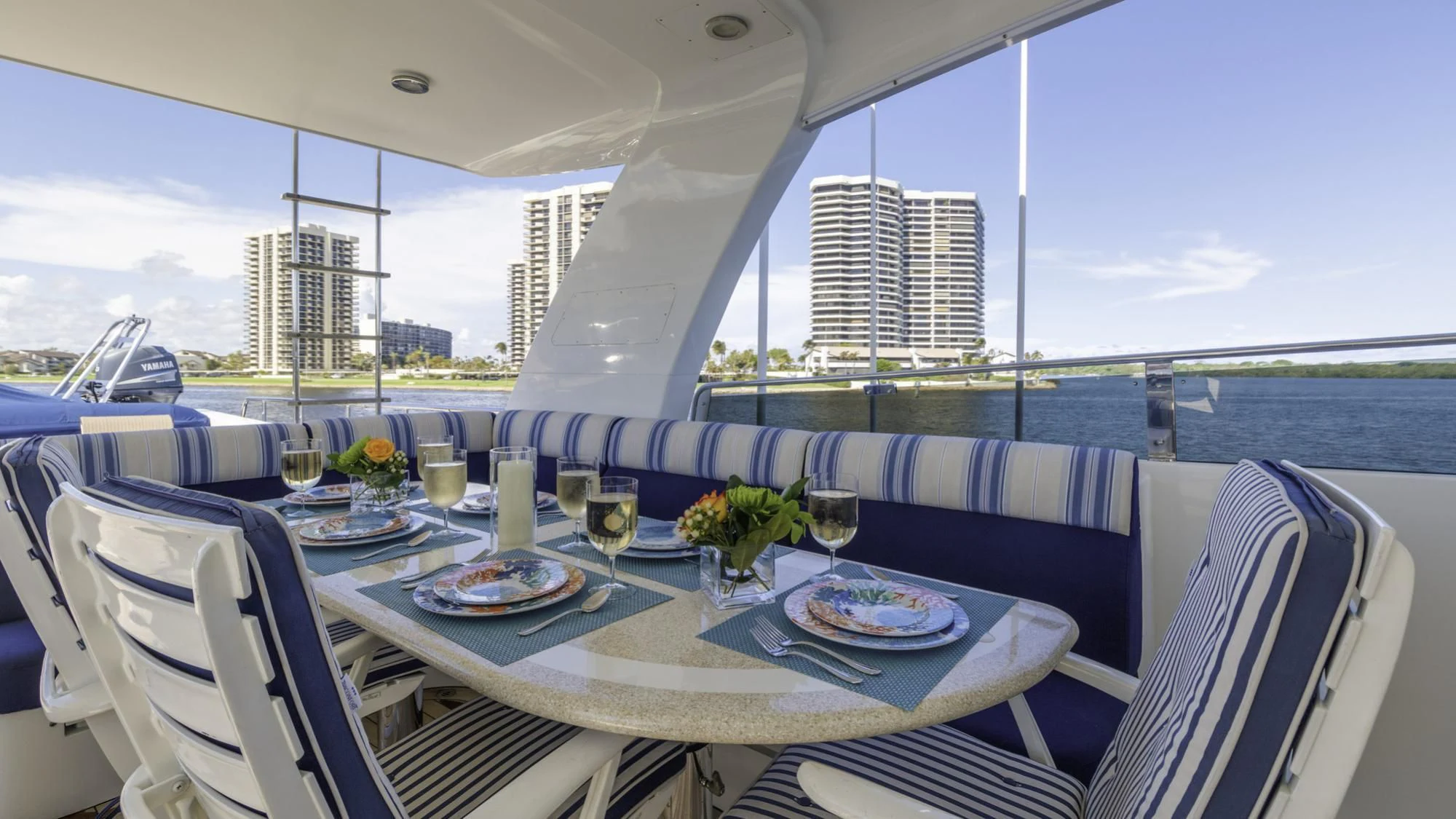 a table with plates and glasses on it aboard WINDWARD Yacht for Charter