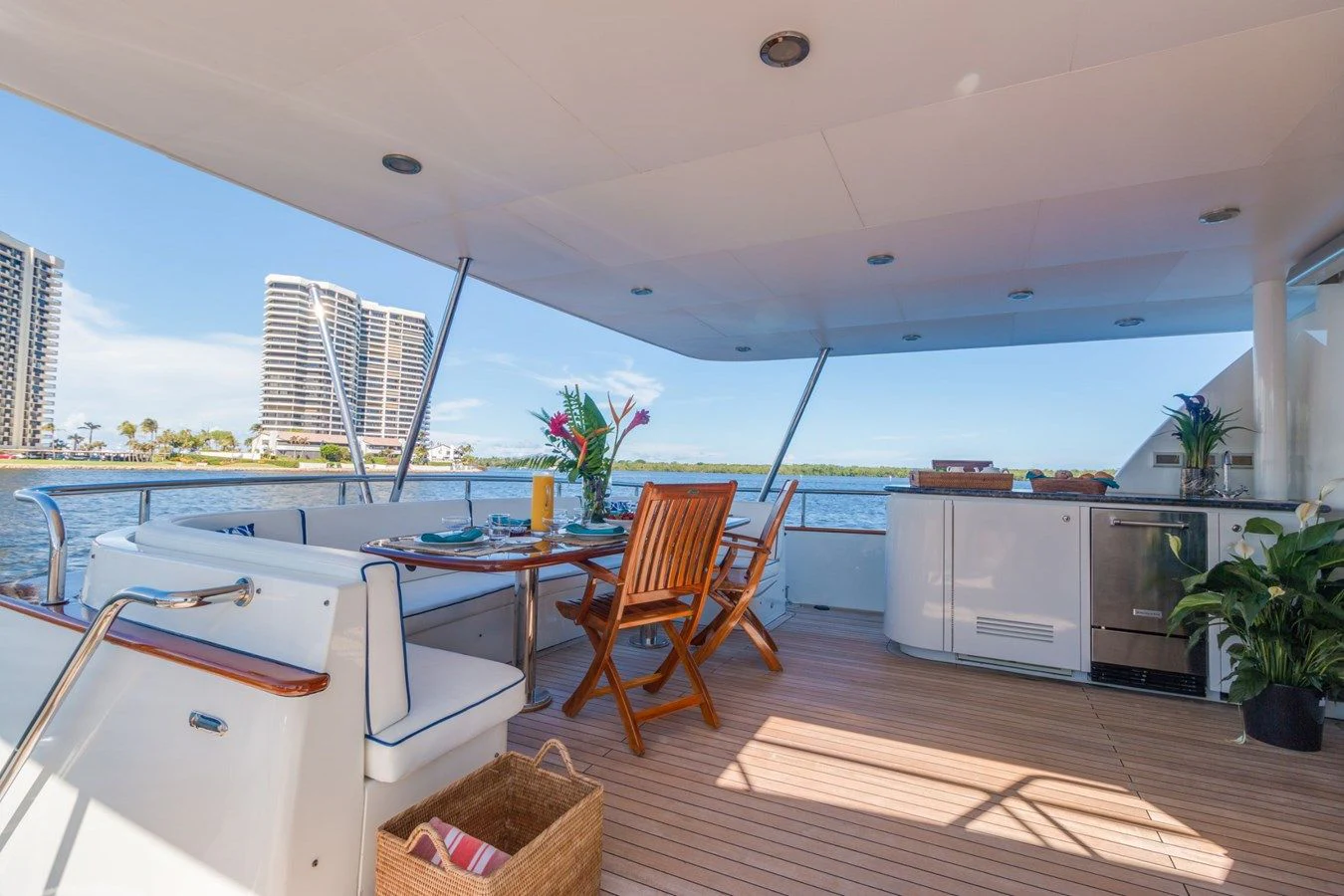 a kitchen with a table and chairs aboard WINDWARD Yacht for Charter