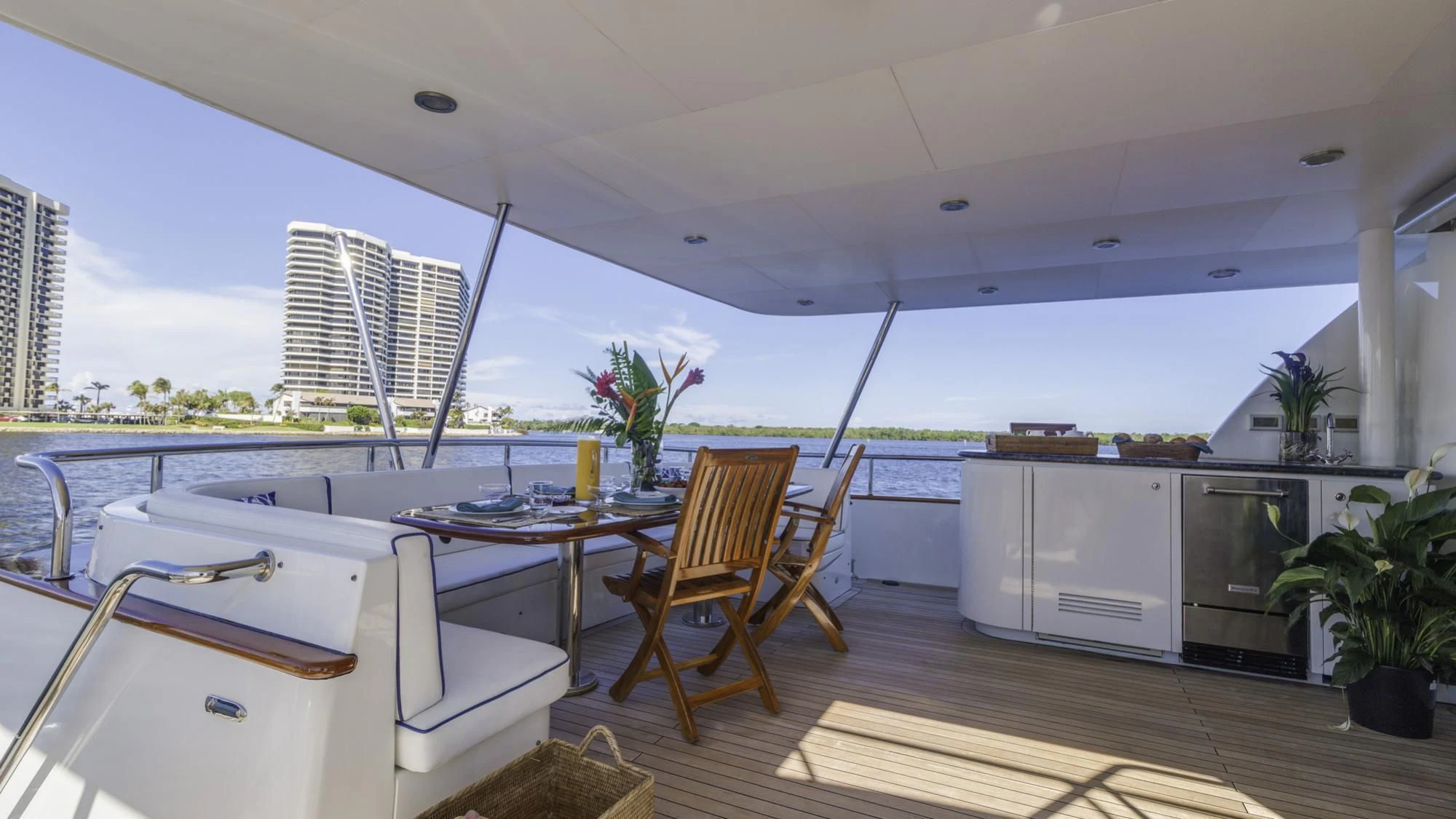 a kitchen with a table and chairs aboard WINDWARD Yacht for Charter