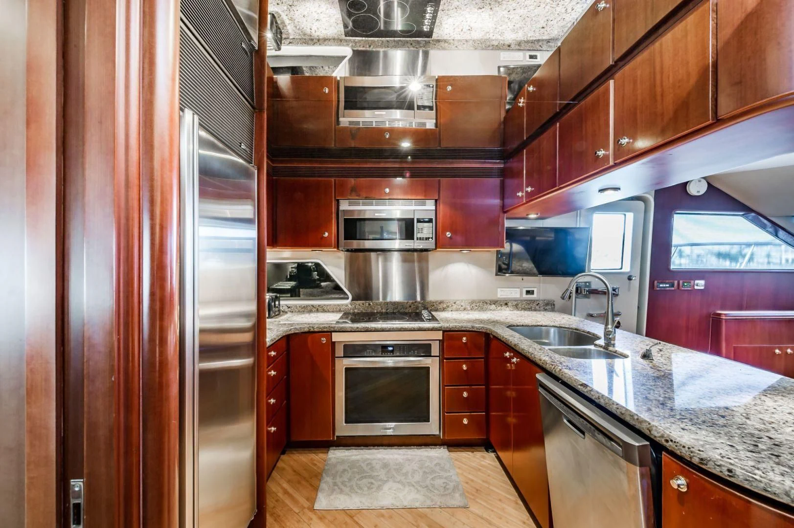 a kitchen with a stove and oven aboard WINDWARD Yacht for Charter