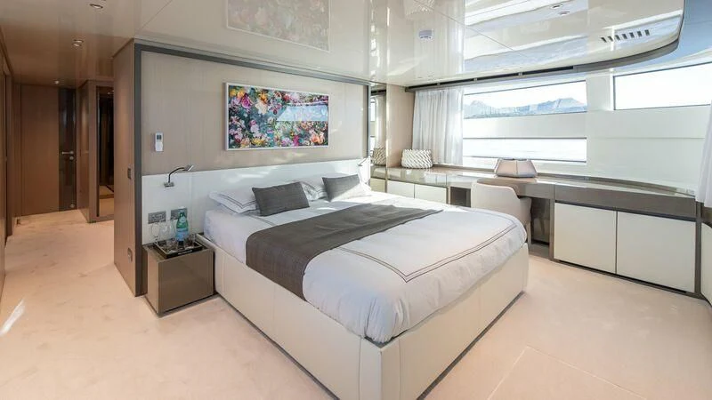 a room with a bed and a desk aboard STONE HILLS Yacht for Sale