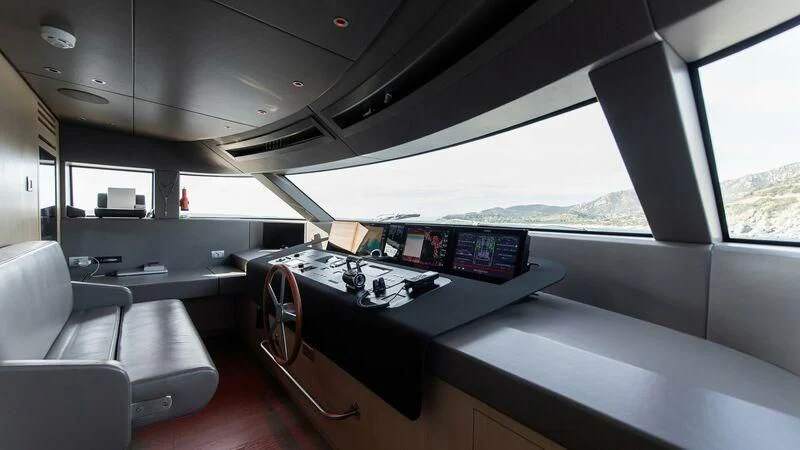 a room with a table and chairs aboard STONE HILLS Yacht for Sale