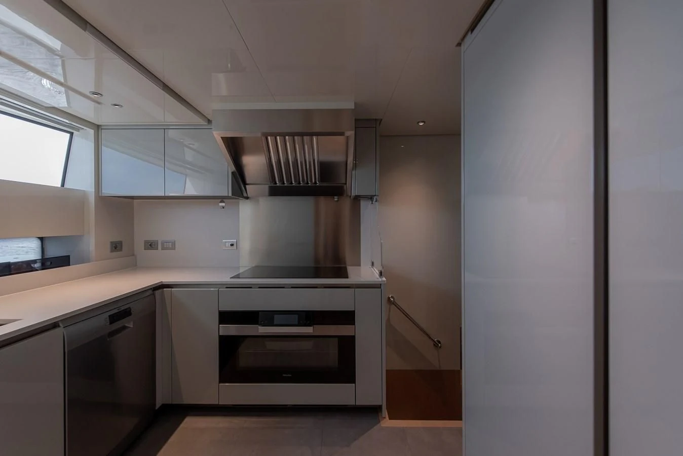 a kitchen with white cabinets aboard STONE HILLS Yacht for Sale