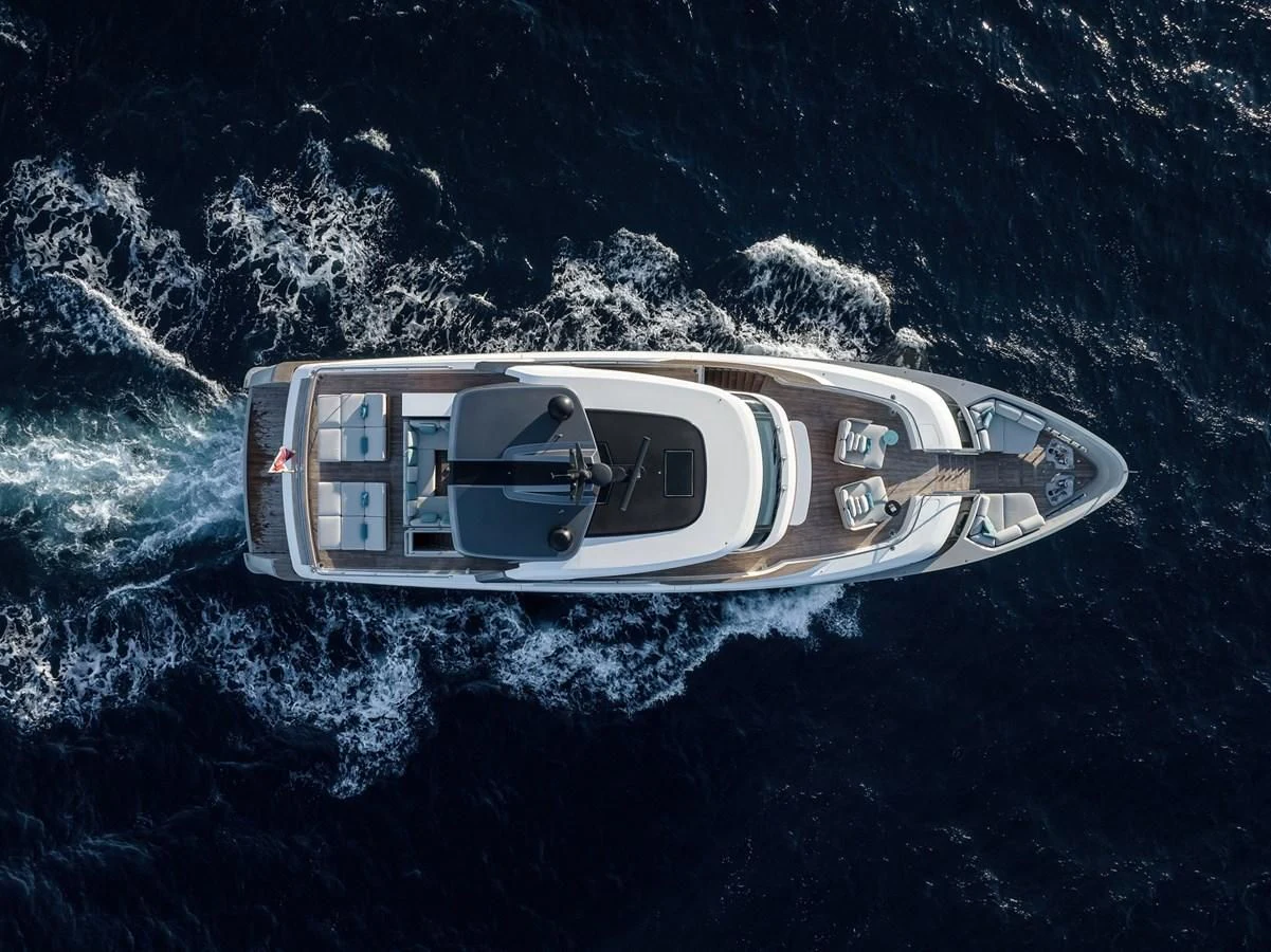 a white car on a rocky surface aboard STONE HILLS Yacht for Sale