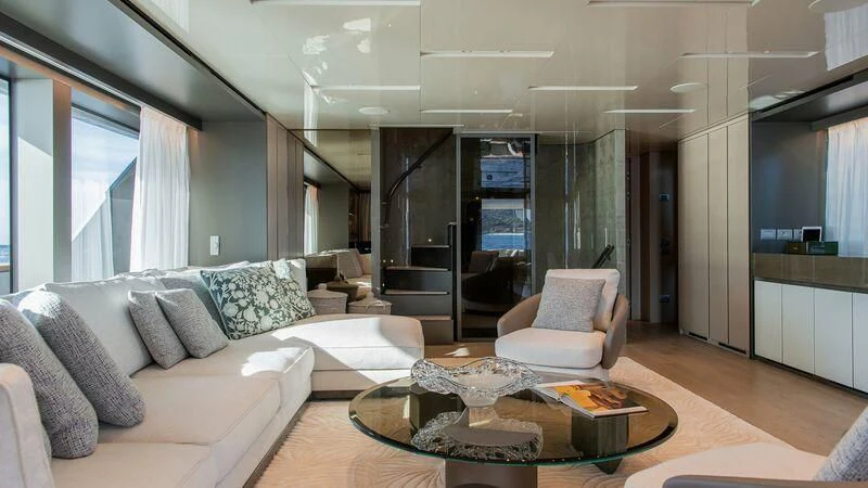 a living room with a couch and a coffee table aboard STONE HILLS Yacht for Sale