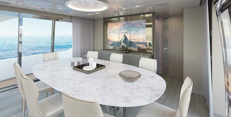 a large room with a table and chairs and a tv aboard STONE HILLS Yacht for Sale