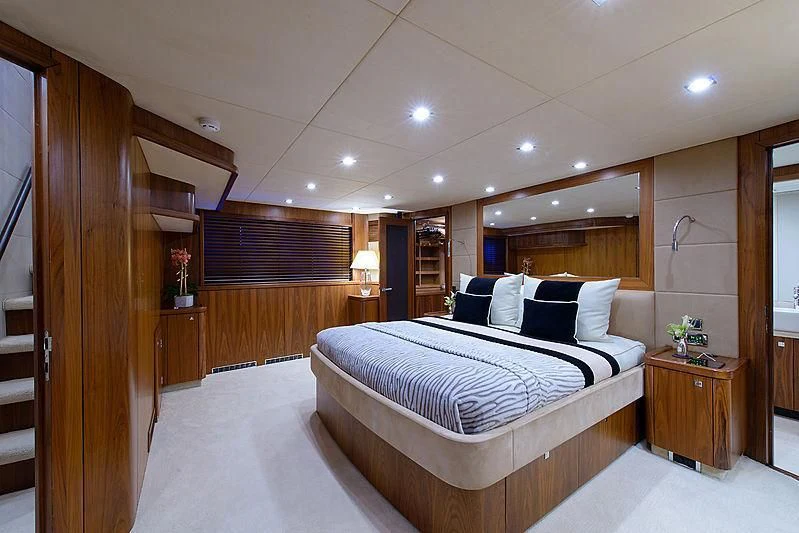 a large bedroom with a large bed aboard CATALANA Yacht for Charter